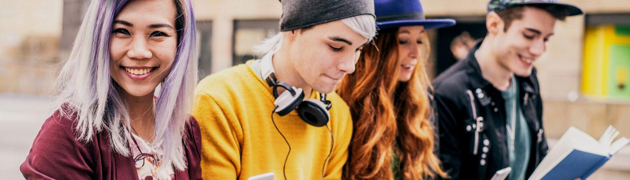 teens with books and phones