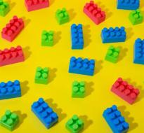 lego_Logo.jpg lego pieces on a yellow background