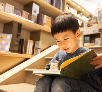 Asian boy reading