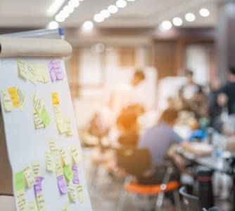Board with post-it notes and board meeting