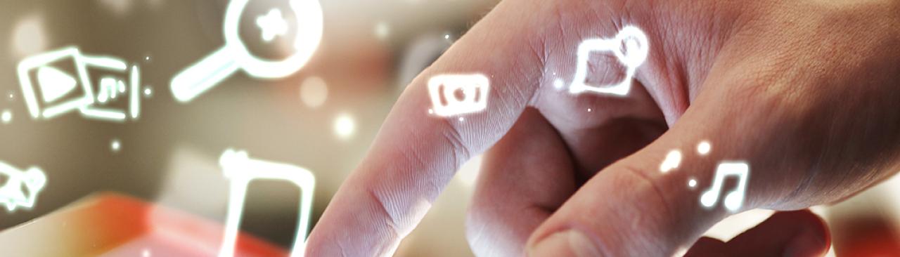diglibrary_bnr.jpg person using pointer finger to select apps on tablet