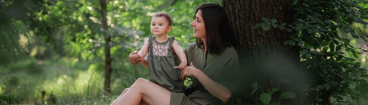 Baby-and-Me-Shady-Tree_hero.jpg A woman and baby under a tree