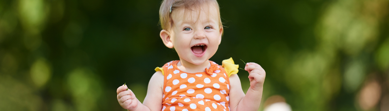 BabyStepsSpring2022_hero.png a baby in a park