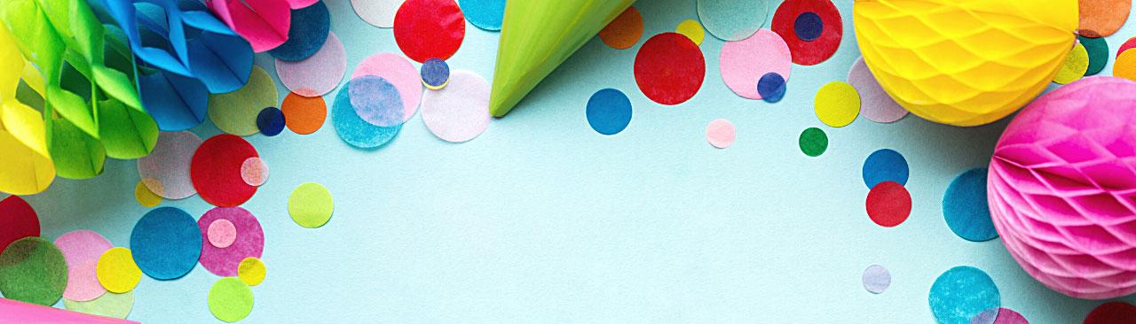 Loot-Packs-hero.jpg party decorations photographed from above on a light blue background