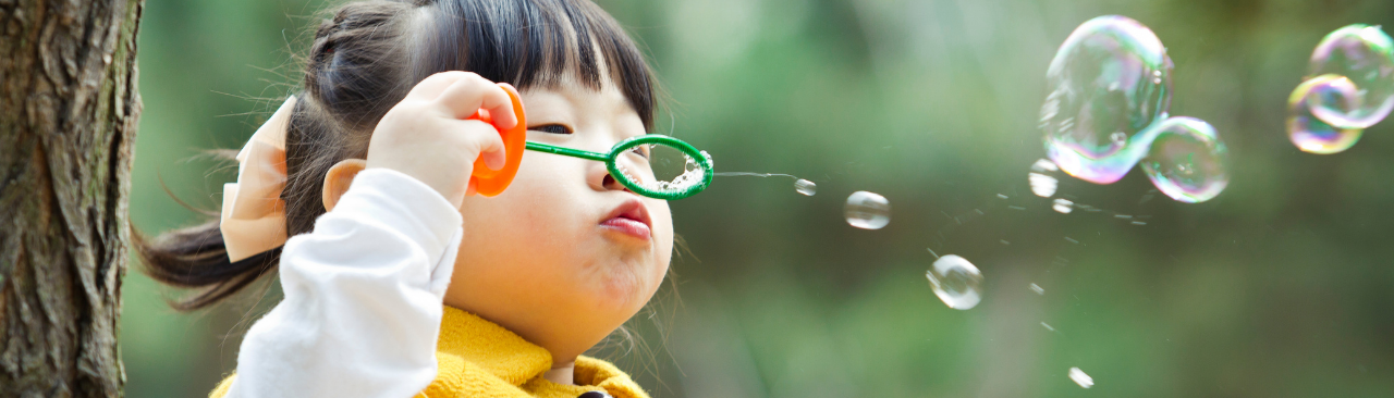 sPark_hero.png A kid blowing bubbles