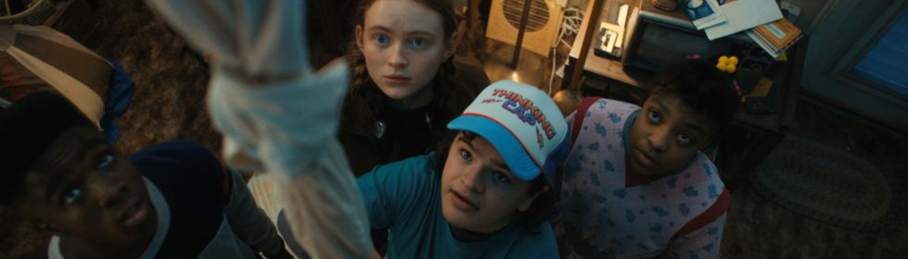 strangerthingsclimb_hero.png The cast of Stranger Things looking up a bedsheet dangling from the upside down